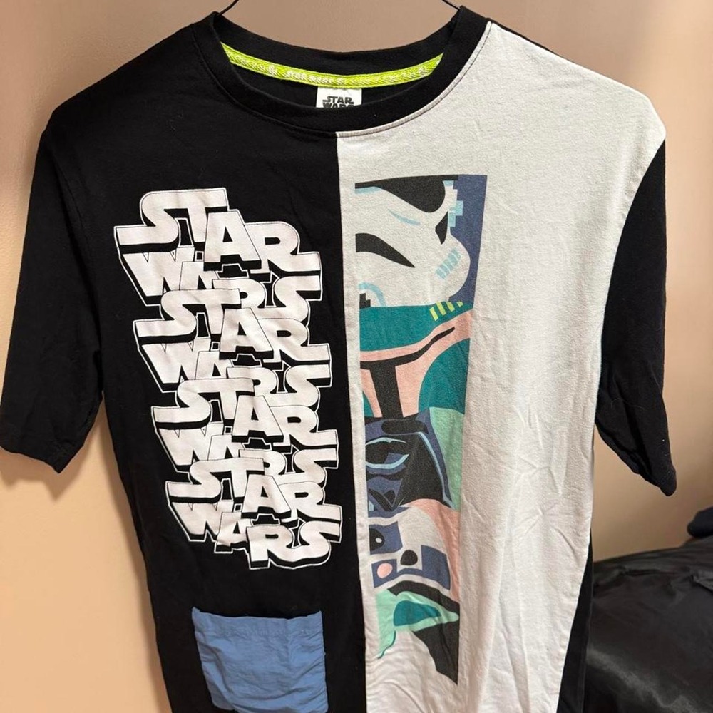 Star Wars T-shirt with white text repeating 'STAR WARS' on black side and gra...